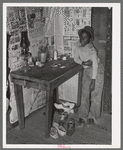 Corner of room of living quarters provided for Negro strawberry pickers near Independence, Louisiana