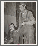 Ex-farmer and his son now living on relief. Outskirts of Jefferson, Texas