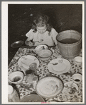 Daughter of white migrant berry picker eating dinner. Hammond, Louisiana