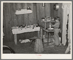 Interior of temporary home of white migrant strawberry pickers near Ponchatoula, Louisiana