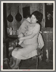 White migratory berry picker and her child near Ponchatoula, Louisiana