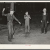 Young migratory berry pickers spinning tops near Ponchatoula, Louisiana