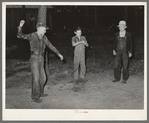 Young migratory berry pickers spinning tops near Ponchatoula, Louisiana