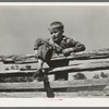 Farm boy resting on rail fence. San Augustine County, Texas