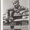 Farm boy resting on rail fence. San Augustine County, Texas