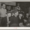 Spectators at cattle auction. San Augustine, Texas