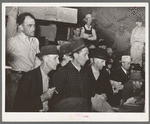 Spectators at cattle auction. San Augustine, Texas