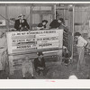 Scene in cattle auction barn. Heifer is coming in from pen. San Augustine, Texas