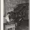Linotype operator. Newspaper office. San Augustine, Texas