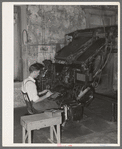Linotype operator. Newspaper office. San Augustine, Texas