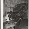 Linotype operator. Newspaper office. San Augustine, Texas