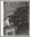 Linotype operator. Newspaper office. San Augustine, Texas
