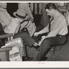 Trying on a pair of shoes. San Augustine, Texas