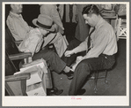 Trying on a pair of shoes. San Augustine, Texas