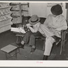 Trying on a new pair of shoes. San Augustine, Texas
