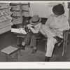 Trying on a new pair of shoes. San Augustine, Texas