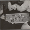 Game of Chinese checkers being played in hotel lobby. San Augustine, Texas