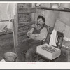 Father of beet worker family resting after a day's work, East Grand Forks, Minnesota