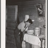 Mexican beet worker washing up after a day's work near East Grand Forks, Minnesota
