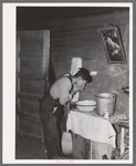 Mexican beet worker washing up after a day's work near East Grand Forks, Minnesota