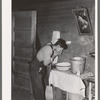 Mexican beet worker washing up after a day's work near East Grand Forks, Minnesota