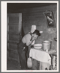 Mexican beet worker washing up after a day's work near East Grand Forks, Minnesota