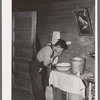 Mexican beet worker washing up after a day's work near East Grand Forks, Minnesota