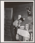 Mexican beet worker washing up after a day's work near East Grand Forks, Minnesota