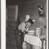 Mexican beet worker washing up after a day's work near East Grand Forks, Minnesota
