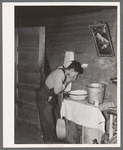 Mexican beet worker washing up after a day's work near East Grand Forks, Minnesota