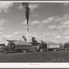 Trucks loaded with sugar beets, factory in background, East Grand Forks, Minnesota