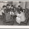 Mexican beet worker family having coffee after a day's work, East Grand Forks, Minnesota