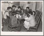 Mexican beet worker family having coffee after a day's work, East Grand Forks, Minnesota