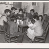 Mexican beet worker family having coffee after a day's work, East Grand Forks, Minnesota