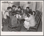 Mexican beet worker family having coffee after a day's work, East Grand Forks, Minnesota