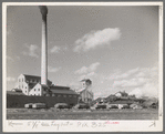 Sugar beet factory with trucks lined up waiting to be unloaded, East Grand Forks, Minnesota