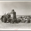 Old auto and Advance Rumley tractor in junkyard at Wildrose, North Dakota. Tractor cost six or seven thousand dollars and burned. A mixture of about fifty percent kerosene and fifty percent water. The water was added to keep the valves from overheating