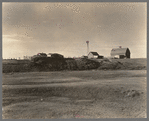Farmstead, Sheridan County, Montana, with manure pile in the coulee. This is rather common practice. Manure is not usually returned to the soil