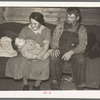 Mr. and Mrs. Harshenberger and baby. Mennonite farmers near Antelope, Montana