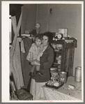 Mother and child in corner of farm home, Sheridan County, Montana