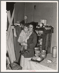Mother and child in corner of farm home, Sheridan County, Montana