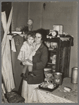 Mother and child in corner of farm home, Sheridan County, Montana