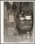 Kitchen stove and bag full of cow dung used as fuel, Sheridan County, Montana