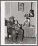 Blaze Gallagher and youngest son in home at Crosby, North Dakota. He was formerly a farmer