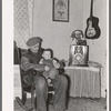 Blaze Gallagher and youngest son in home at Crosby, North Dakota. He was formerly a farmer