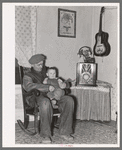 Blaze Gallagher and youngest son in home at Crosby, North Dakota. He was formerly a farmer