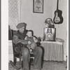 Blaze Gallagher and youngest son in home at Crosby, North Dakota. He was formerly a farmer
