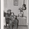 Blaze Gallagher and youngest son in home at Crosby, North Dakota. He was formerly a farmer