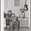 Blaze Gallagher and youngest son in home at Crosby, North Dakota. He was formerly a farmer