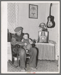 Blaze Gallagher and youngest son in home at Crosby, North Dakota. He was formerly a farmer